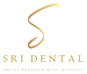Gold stylized S above text 'SRI DENTAL' and tagline 'Smiles Rendered With Integrity'.